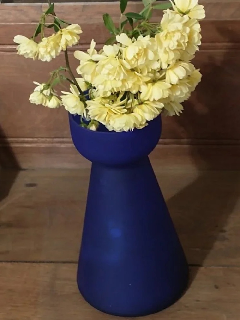 Matte Navy Blue Decorative Ceramic Vase with Soft Yellow Floral Accent
